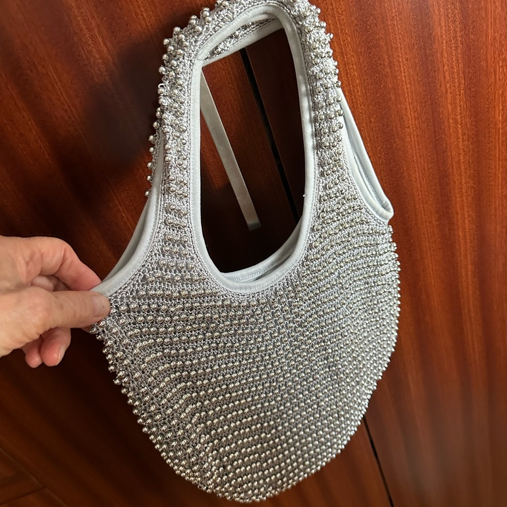 New Very cute knitted bag decorated with beads. Unbranded.Nice silver tone.